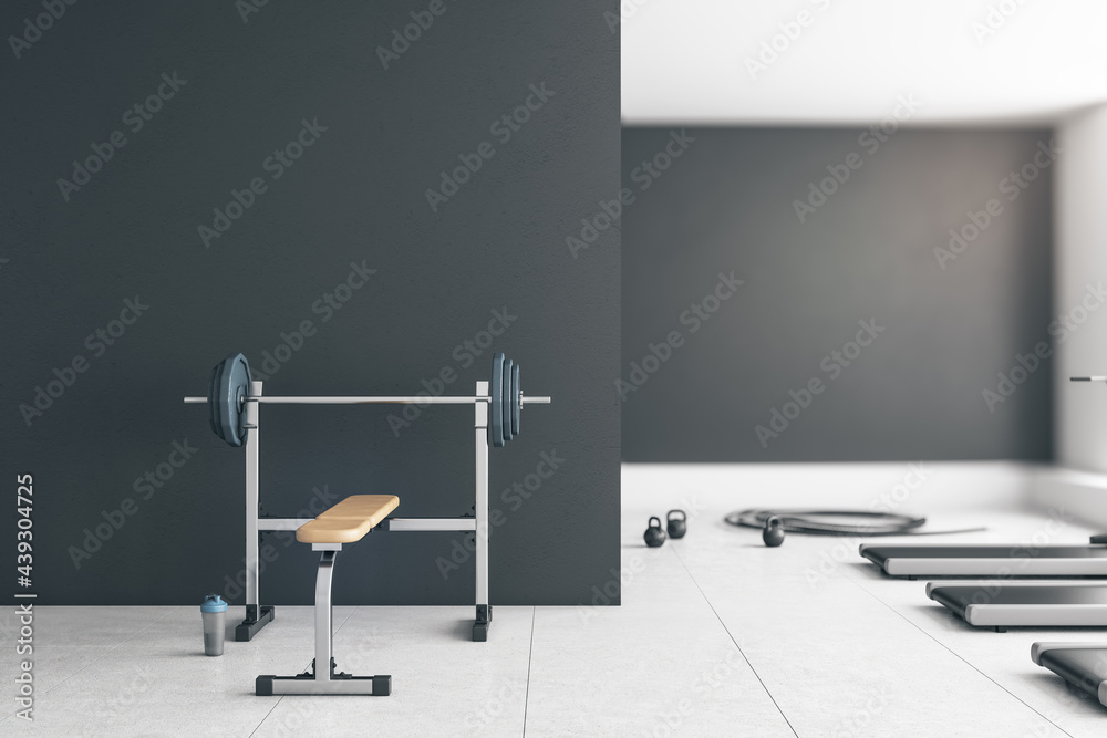 Grey gym interior with empty mockup space, equipment and daylight. Mock up, 3D Rendering.