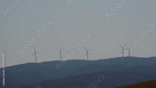 wind turbines stopped due to lack of wind in a hot summer day