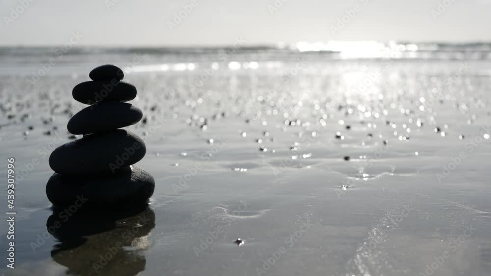 Balance Rocks Ocean Rock balancing on ocean beach, stones stacking by sea water waves ...