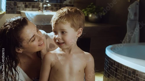 Happy mom and her son after bath