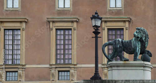 Photography a traditional lantern next to the bronze statue of a lion, Lion Slope, in front