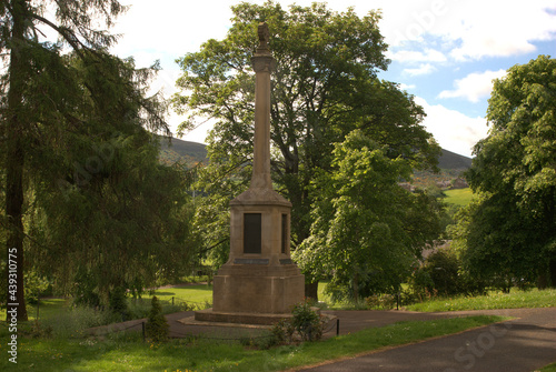 war memorial in park in Melrose with Eildon hills photo