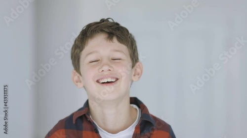 Cute little boy laughing heartily photo