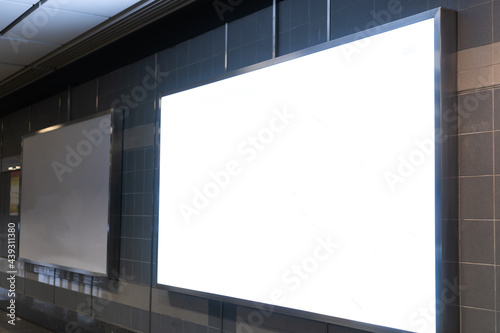 Blank billboard mock up signboard frame advertising located in subway underground hall, blurred background layout insert text for customer