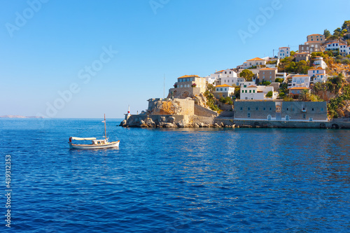 Wooden boat entering Hydra island in Saronikos gulf in Greece
