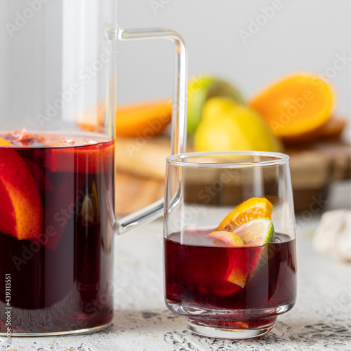 Glass with Sangria drink, famous Spanish summer beverage making with wine and fruit. photo