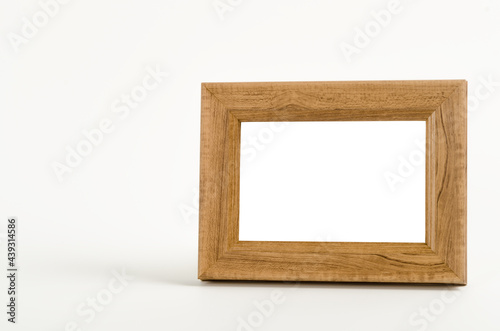 Empty wooden frame on white background.