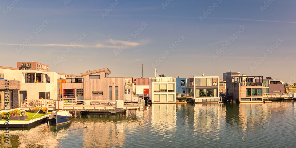 Row of contemporary house boats in the IJburg district in Amsterdam, The Netherlands