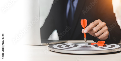 Dart is an opportunity and Dartboard is the target and goal. So both of that represent a challenge in business marketing as concept. photo