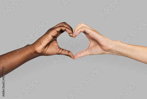 Diverse hands gestured in heart-shape photo