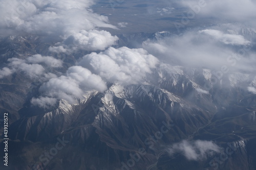 white clouds above snow mountain. High angle view.