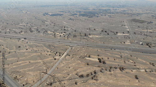 AERIAL. Top view of Road between mountains in UAE photo