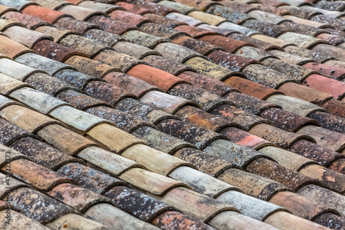 Pattern view of old orange tiles, used in the roofs of traditional architecture buildings, orange clay half-brim tile
