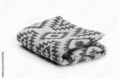 Luxurious Christmas gift, woolen throw blanket in Pendelton style on a white background. photo