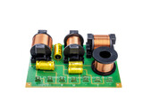 Audio frequency separation electronics for speakers, three-way crossover network, circuit board, clipping path isolated on white background.