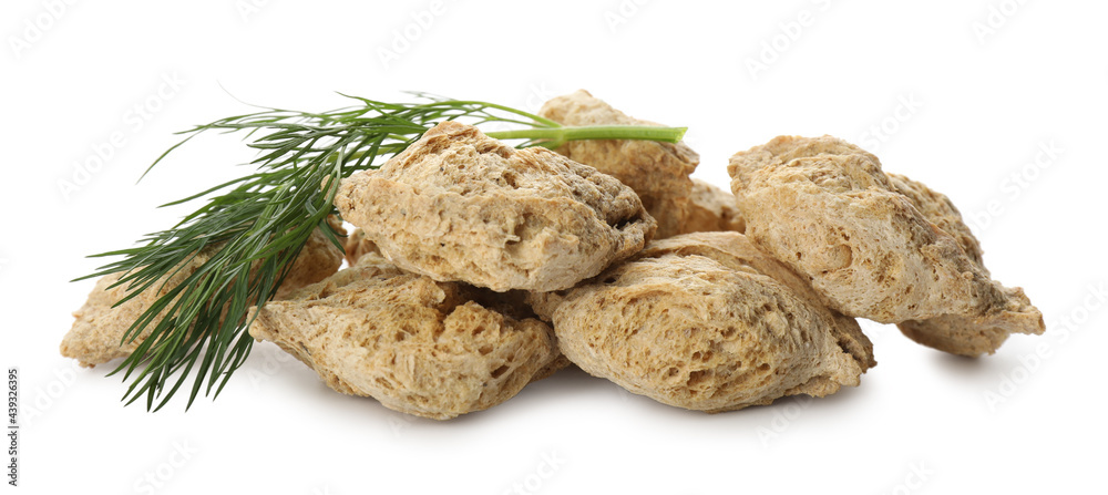 Dehydrated soy meat chunks with dill on white background Dehydrated soy meat chunks with dill on white background