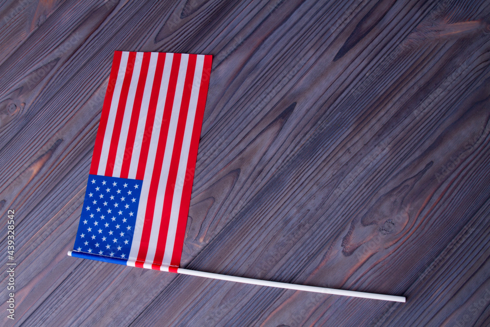 Top view flag of the USA on wood with copy space.
