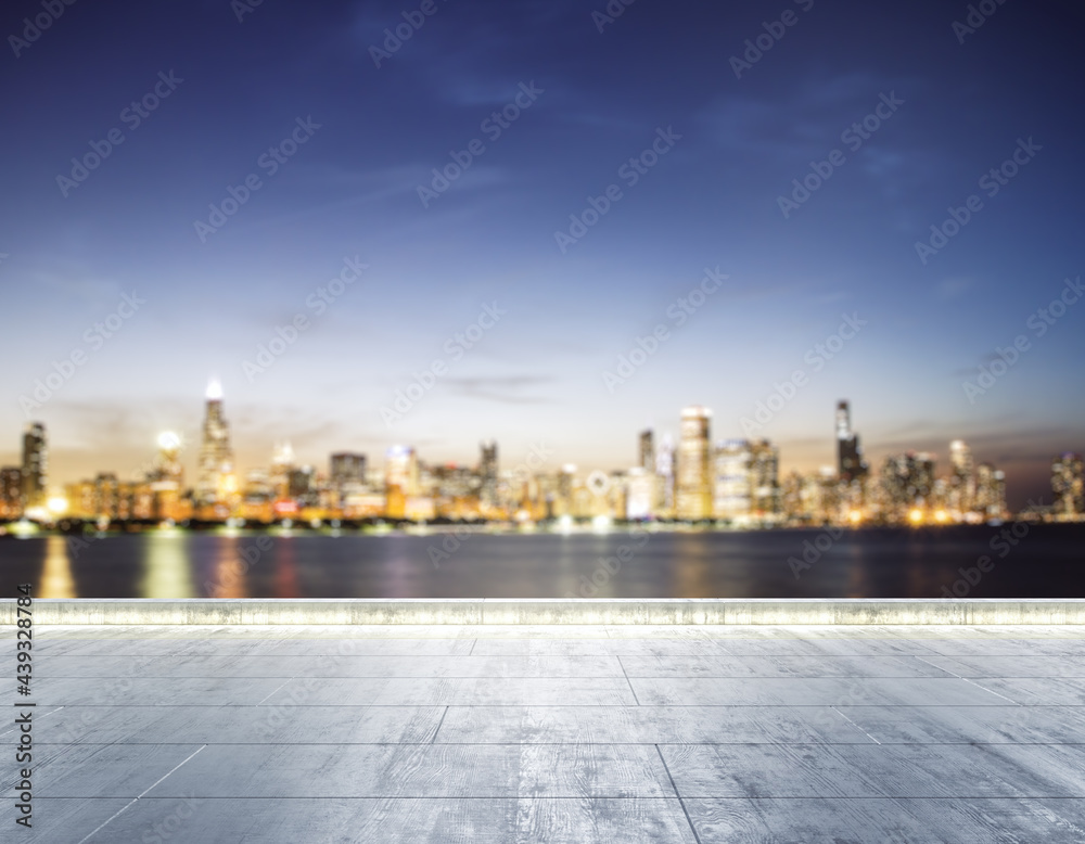 Empty concrete dirty embankment on the background of a beautiful blurry Chicago city skyline at night, mock up