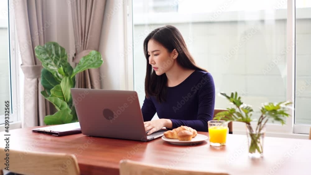 Work from home concept a female freelancer looking happy while working online in her own space during Covid 19 pandemic. Work from home concept a female freelancer looking happy while working online in her own space during Covid 19 pandemic.
