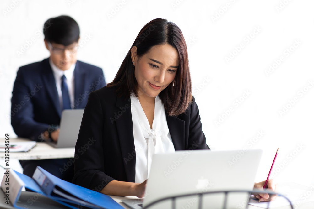 Attractive businesswoman and man manager are colleagues working together Attractive businesswoman and man manager are colleagues working together