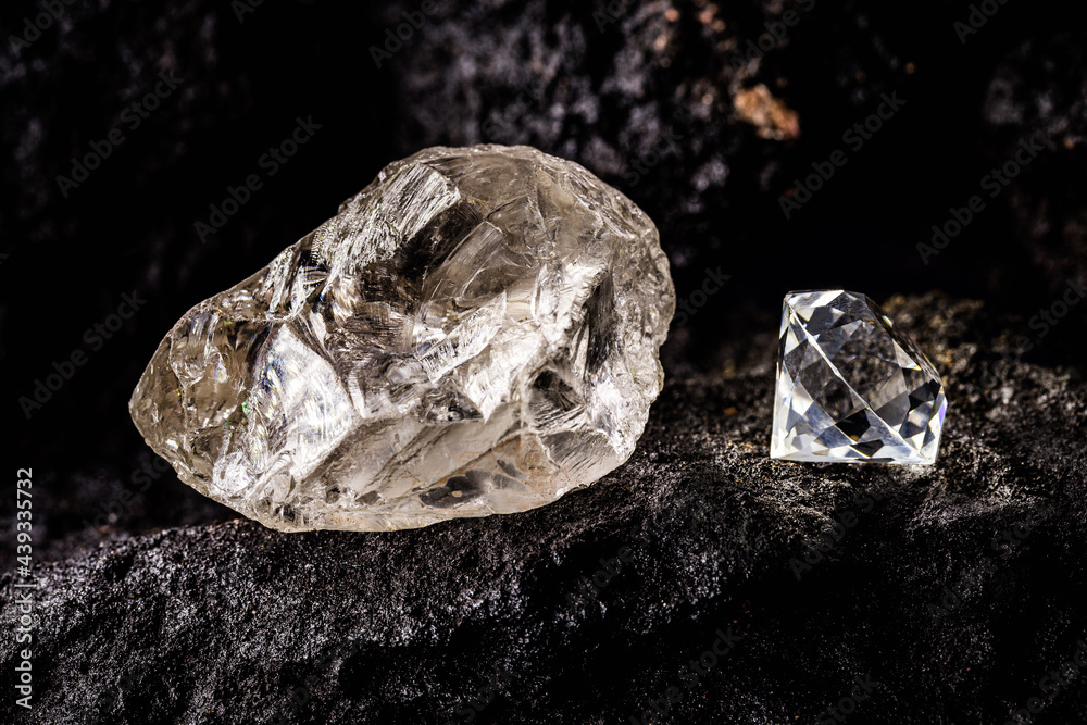 cut diamond with rough diamond gem on kimberlite rock, on isolated  background, diamond business concept. Stock Photo | Adobe Stock