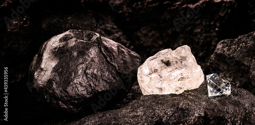 diamond mine with rough diamond stone, cut diamond and carbon or graphite ore, on kimberlite rocks, transformation into rare stone concept