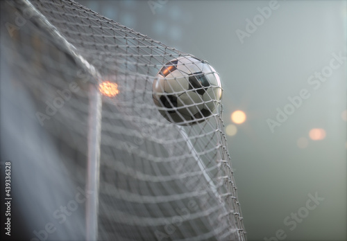 Soccer ball, scoring the goal and moving the net. photo