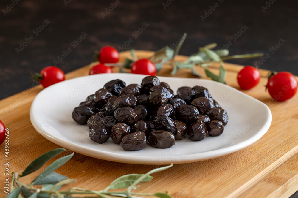 Black olive. Tasty black olives in the plate. Black olive. Tasty black olives in the plate.
