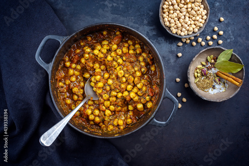 Fotografie Traditional Indian chana masala curry stew with chickpeas and spices served as t
