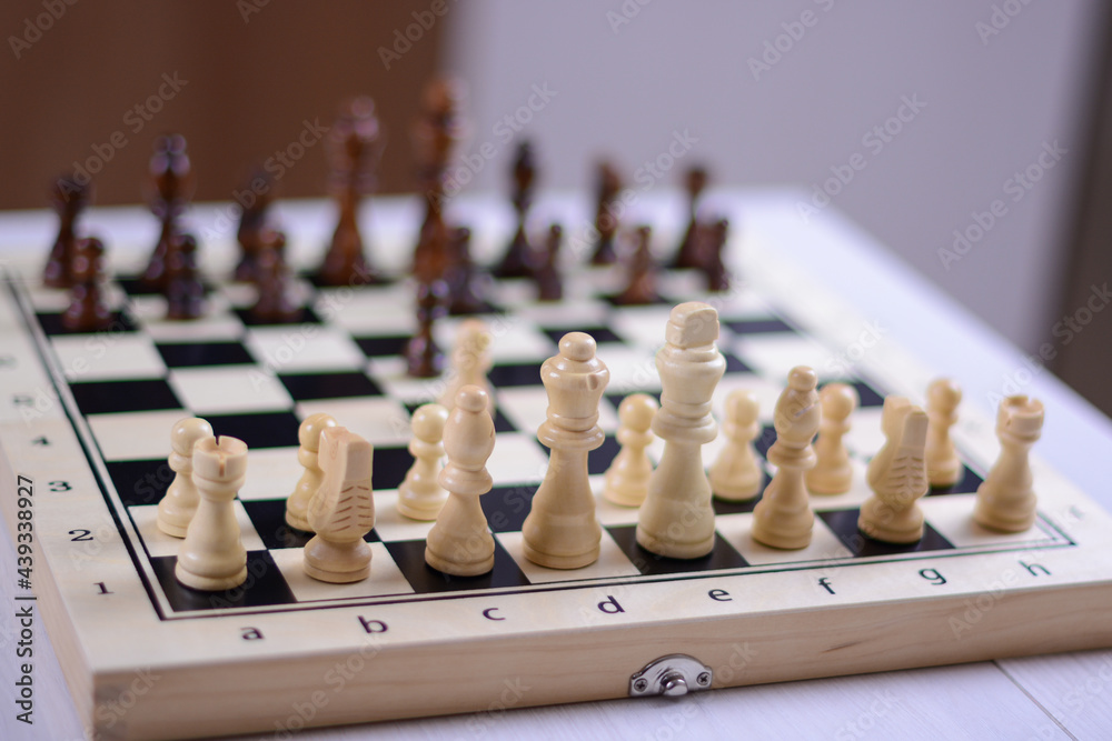Black to move. White pieces in focus. Initial position of pieces and pawns. Black to move. White pieces in focus. Initial position of pieces and pawns.