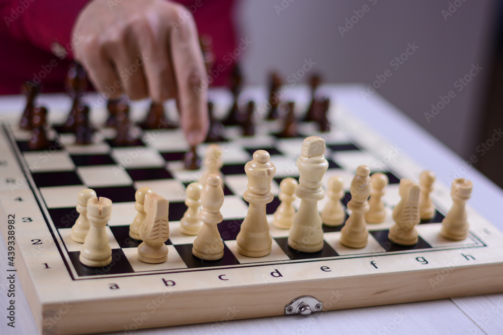 Black to move. White pieces in focus. Initial position of pieces and pawns. Black to move. White pieces in focus. Initial position of pieces and pawns.