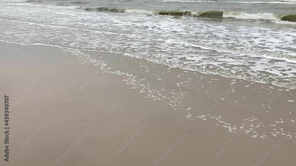 Slow motion ripple ocean waves, cloudy sky, rainy day. Slow motion ripple ocean waves, cloudy sky, rainy day.