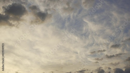 Amazing unusual peaceful early morning sunrise blue sky with soft pastel white fluffy clouds