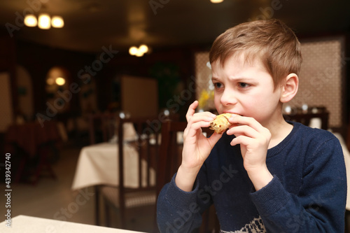 Child eating serbian cheese pie