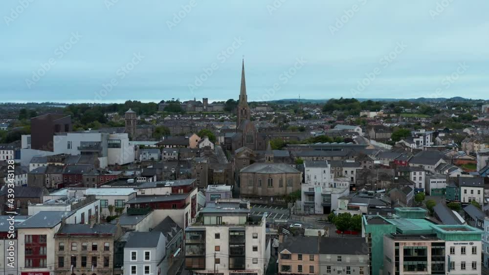 Early morning over the Irish Viking town of Wexford. Aerial view of drone tracking right, revealing city architecture.