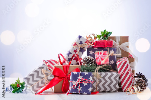 Christmas gift boxes on blue bokeh background.