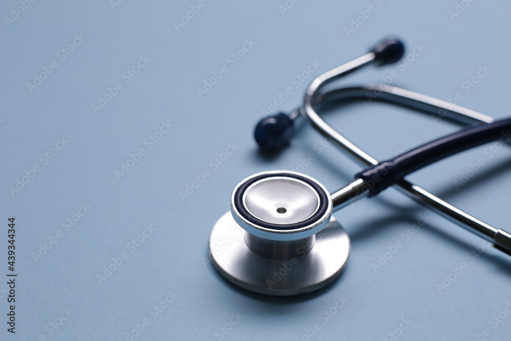 Blue medical stethoscope isolated on blue background Blue medical stethoscope isolated on blue background
