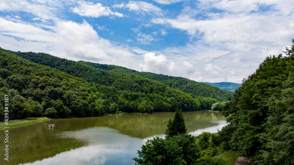 Drone footage over the mountains clouds before rain