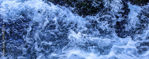 Banner. Areal view of water. Blue water background. Water foam.