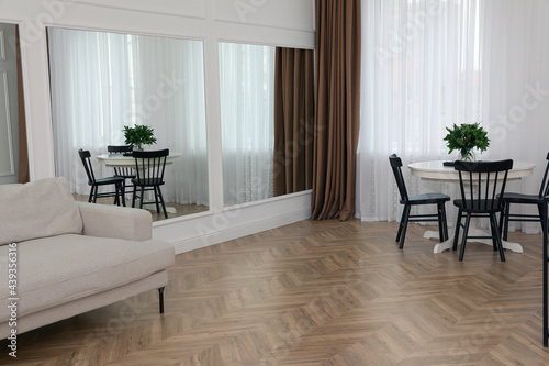 Modern room with parquet flooring and stylish furniture © New Africa