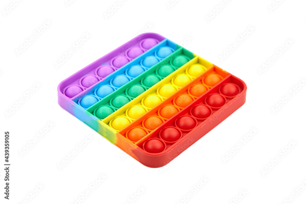 Pop it fidget toy isolated on white background. Rainbow square anti stress fidget. Pop it fidget toy isolated on white background. Rainbow square anti stress fidget.