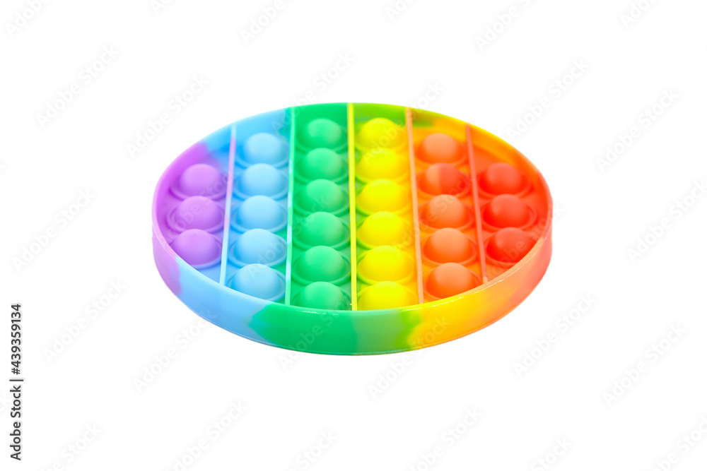 Pop it fidget toy isolated on white background. Rainbow round anti stress fidget Pop it fidget toy isolated on white background. Rainbow round anti stress fidget