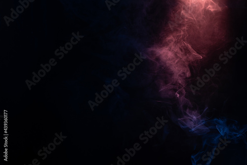 Blue and pink steam on a black background.