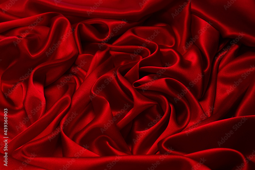 Fototapeta premium Rich and luxury red silk fabric texture background.