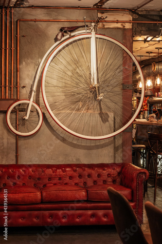 Vintage bicycle hanging on the wall in the liquor pub in Saint Petersburg, Russia.