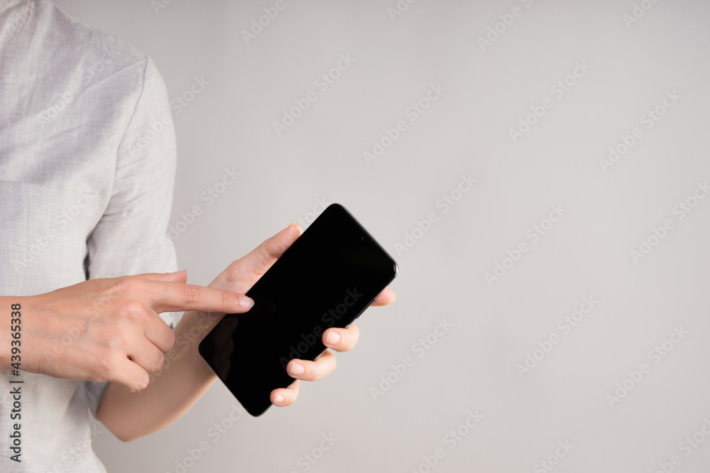 smartphone with a touch screen in a woman's hand. Use your phone with a touchpad, layout for your design. smartphone with a touch screen in a woman's hand. Use your phone with a touchpad, layout for your design.