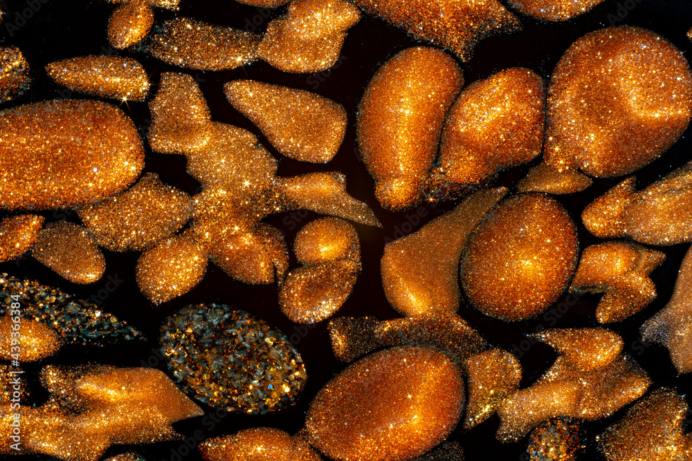macro shot of copper golden insertions in murano black glass macro shot of copper golden insertions in murano black glass