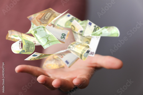 euro bills flying around  i...