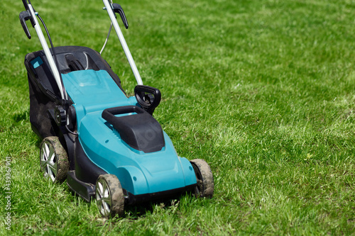 Lawn mower on the grass