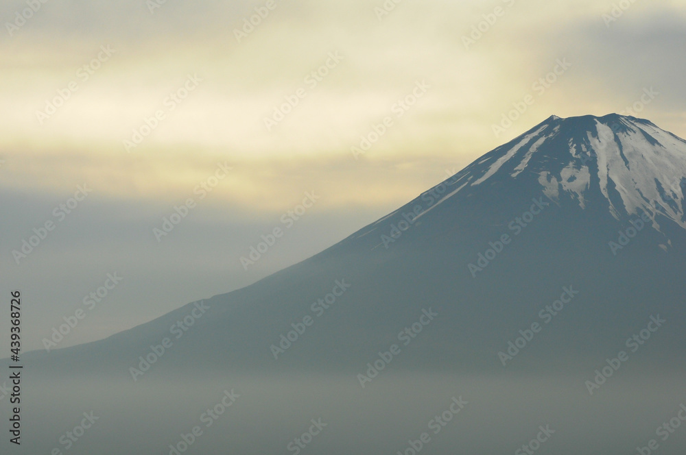 View of Mount Fuji at dusk, from the fumaroles in Mount Hakone, Hakone, Kanagawa Prefecture, Japan. The picture is in landscape view